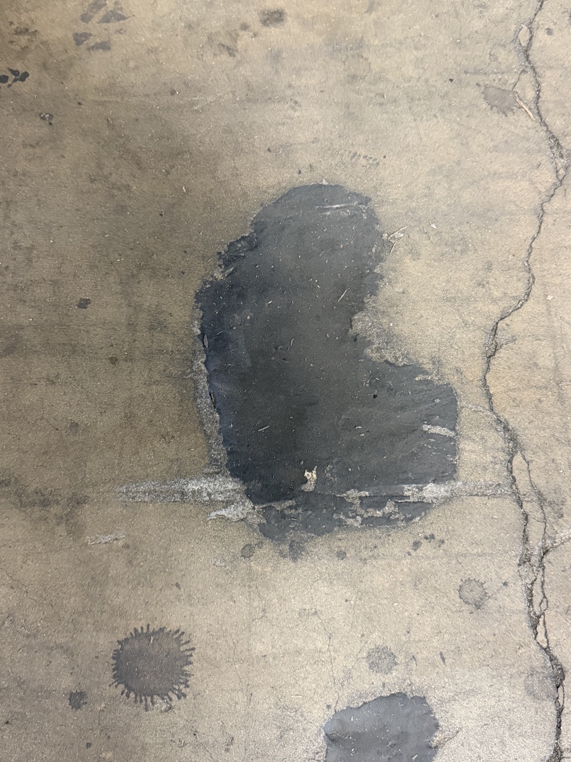 A previous patch repair that has cracked and failed