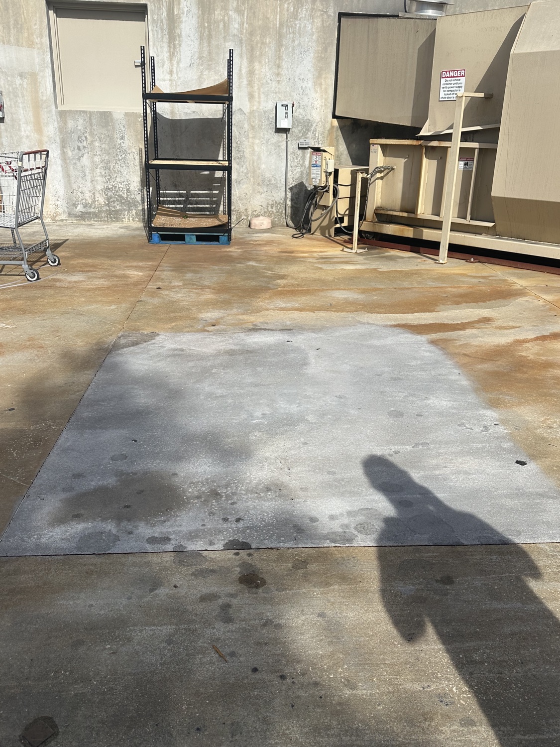 Cleaned and ground test patch cutting through the rust staining on an exterior pad