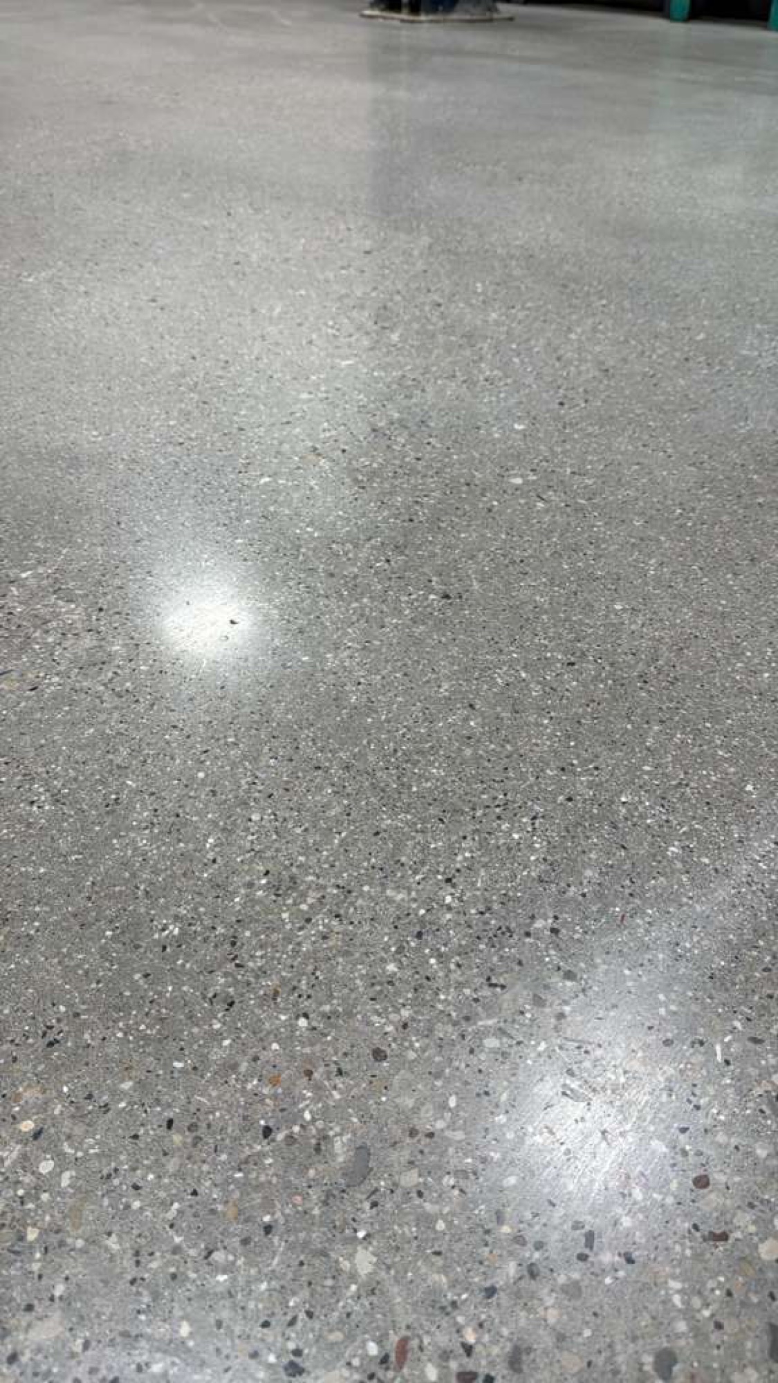 Close-up of polished concrete with exposed aggregate and a high reflective shine